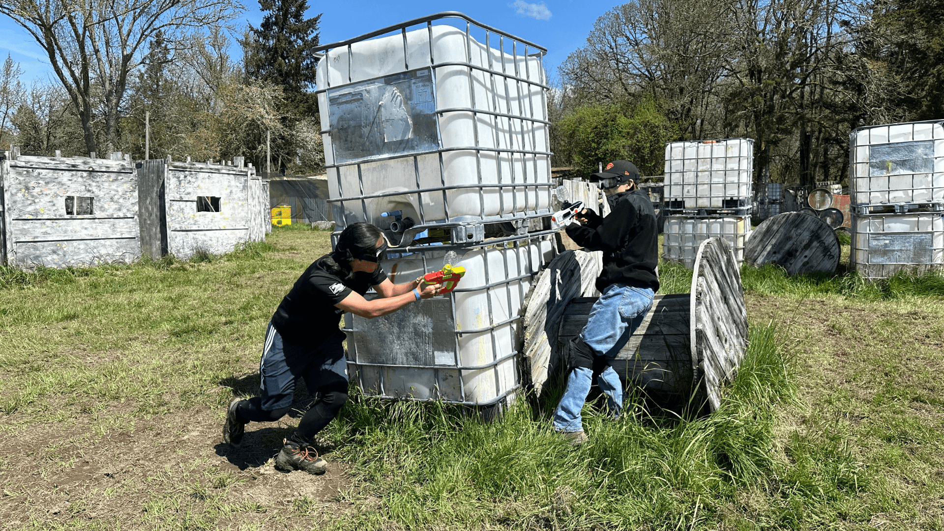 Orange Airsoft Club members in tactical gear during a game