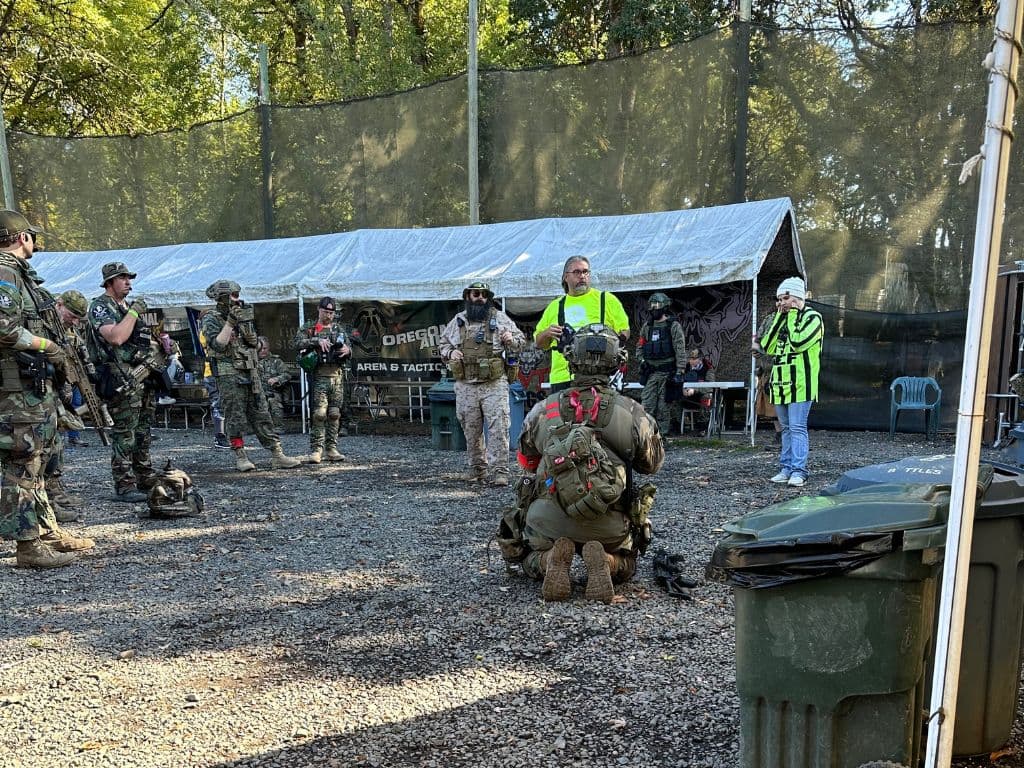 Training session showing airsoft gear setup and safety brief